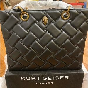 A geometric quilted design with removable crossbody strap for versatile styling.